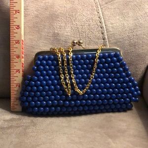 New w/o tags. Blue beaded clutch with gold shoulder strap